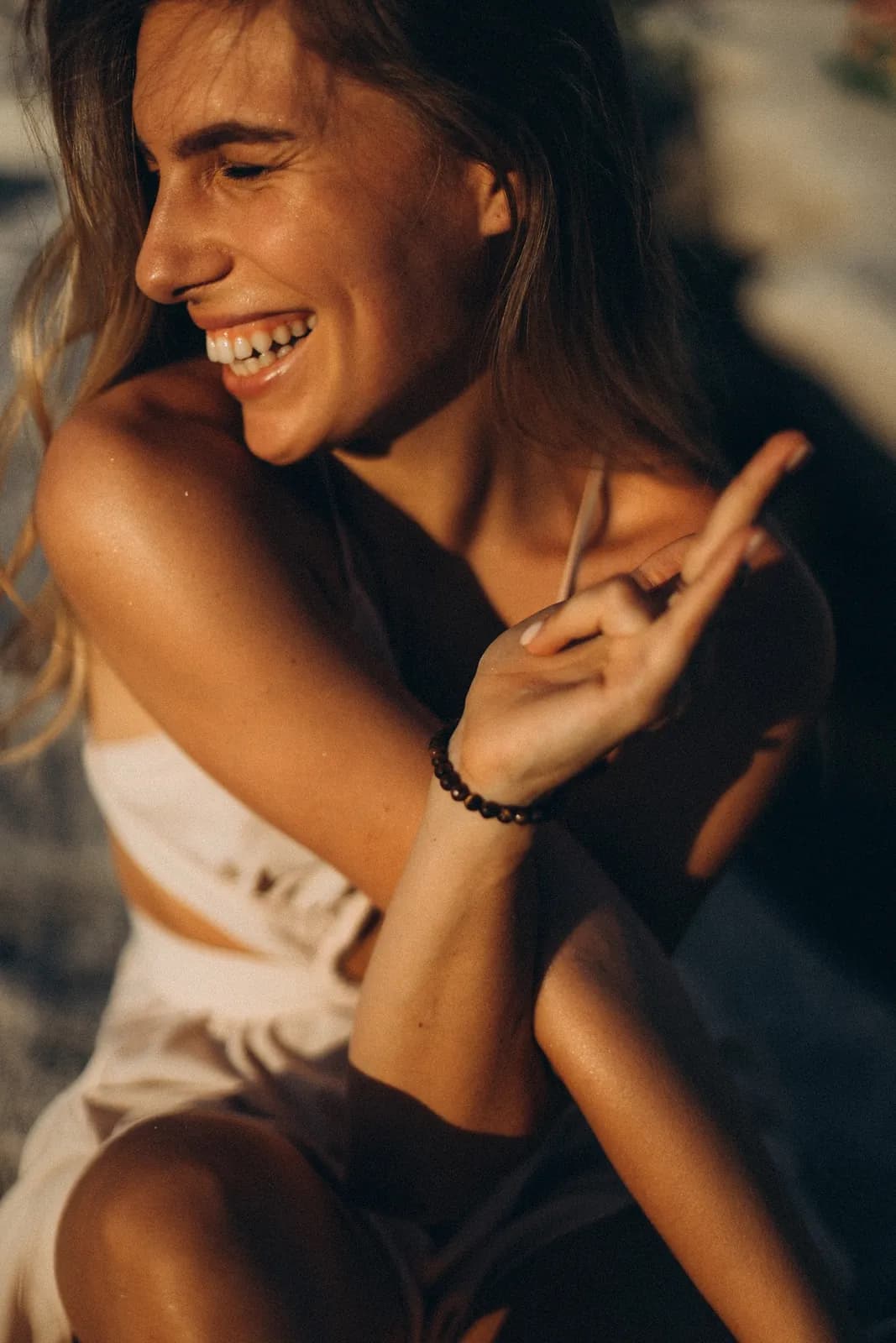 Close-up of Julia laughing in warm evening light