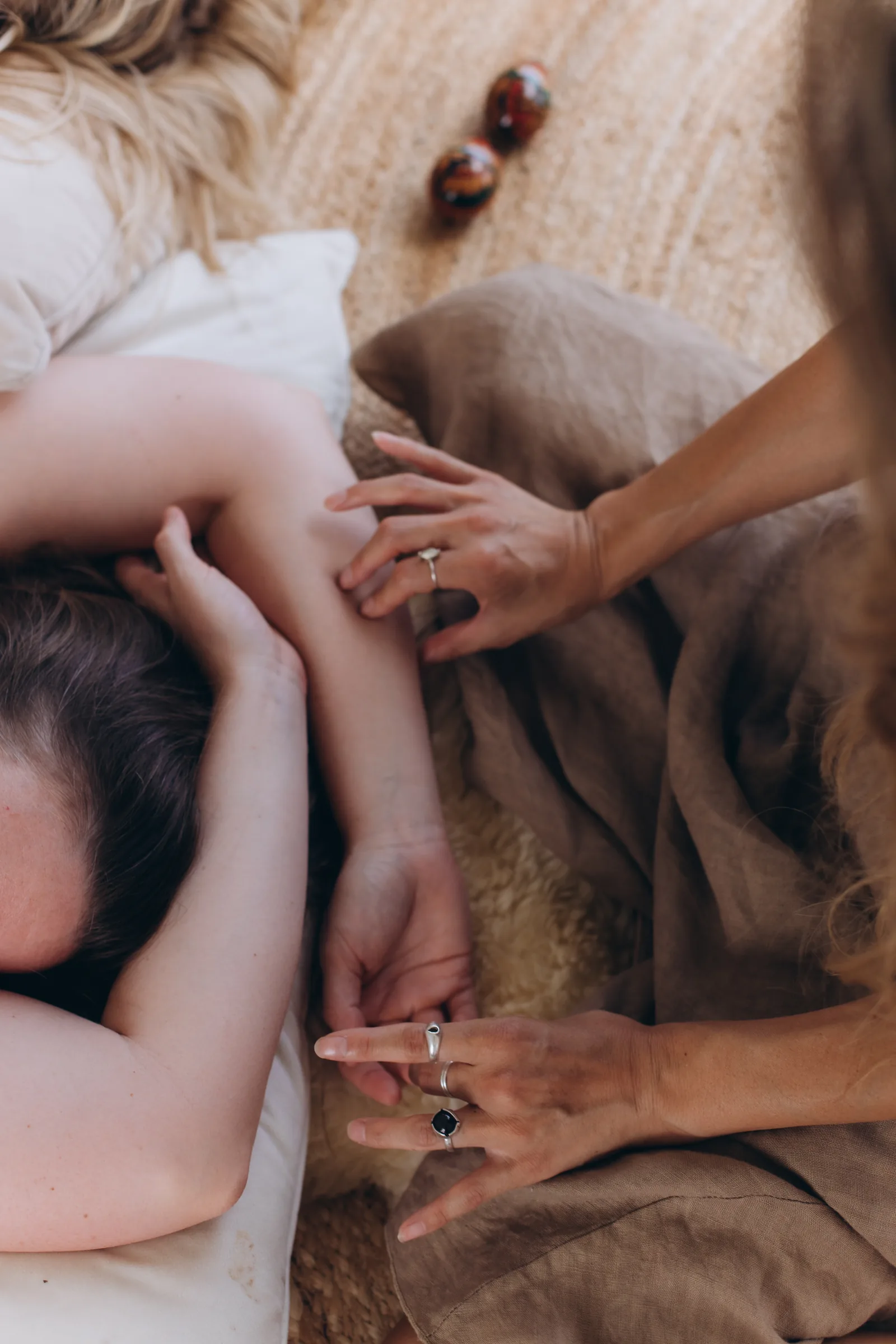 Close view of hands moving along a client's arm.