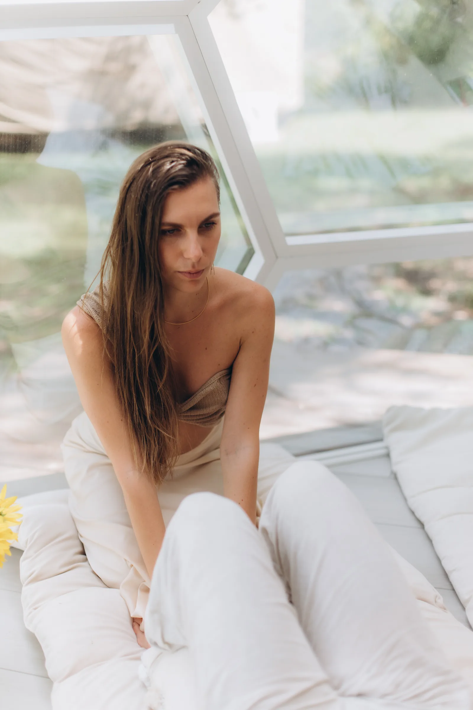 Julia seated by the window at the end of a session
